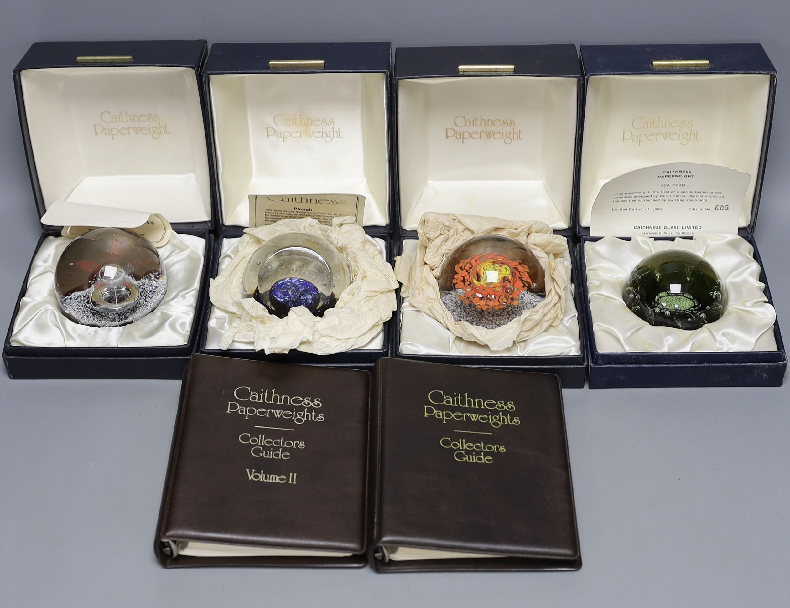 Four cased Caithness glass paperweights